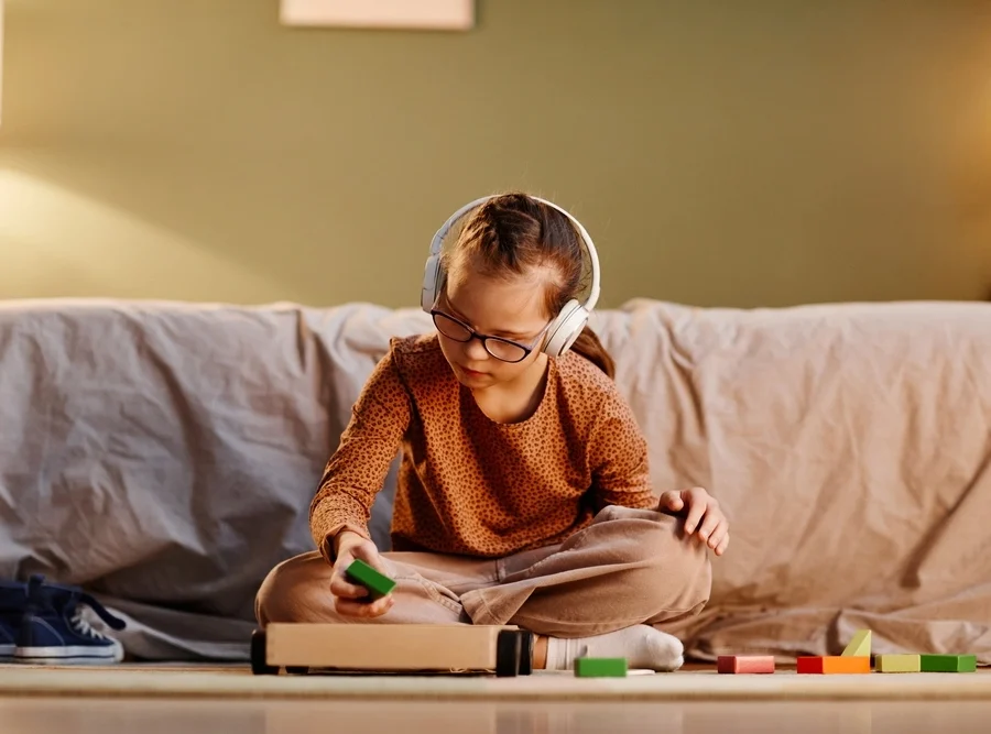 teen girl with down syndrome disabilities reading books