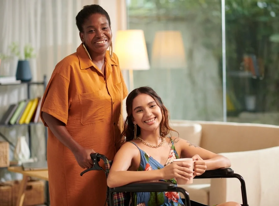 nurse taking care of disabled girl on wheelchair